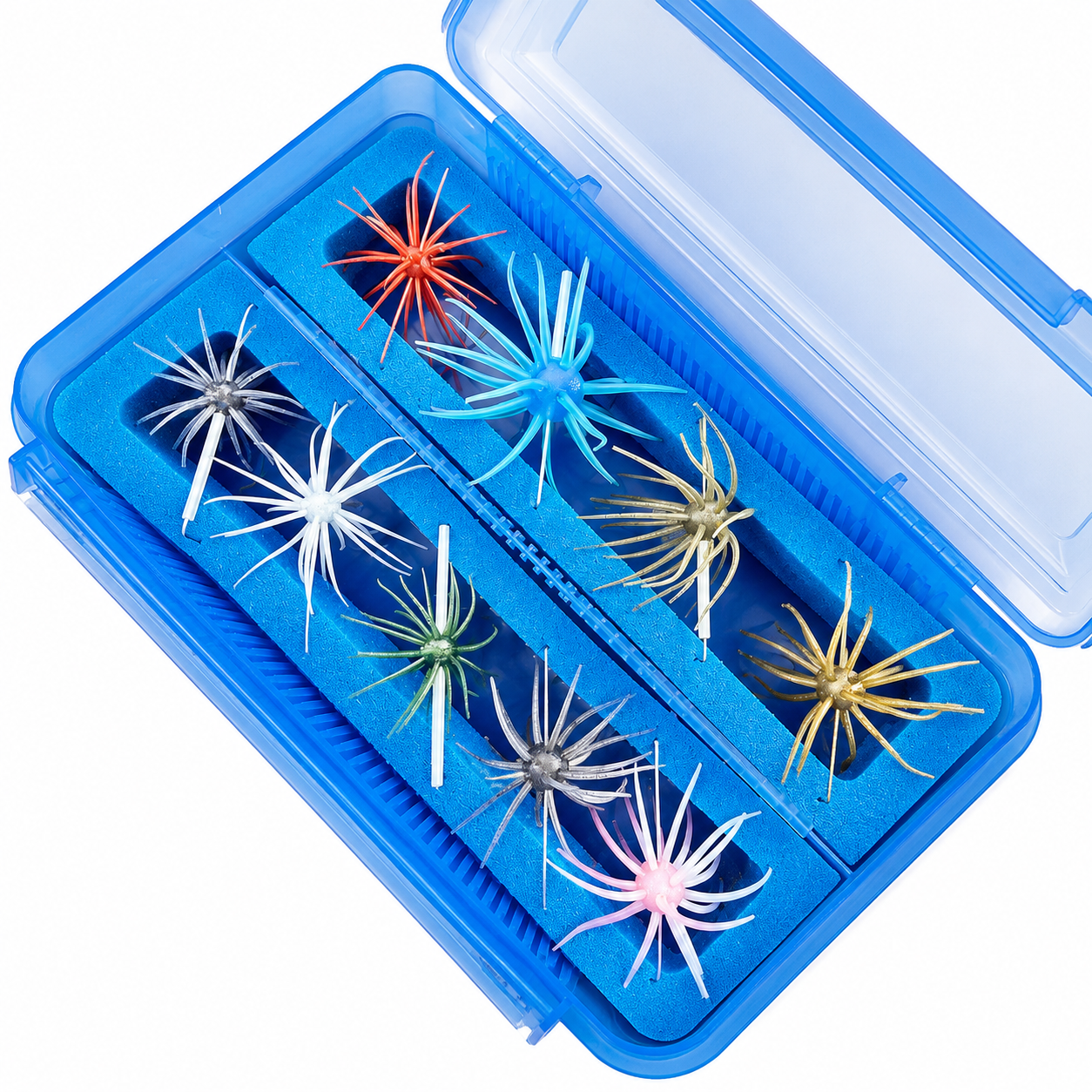 Blue foam insert in a clear blue tackle box, organizing colorful Coike baits.